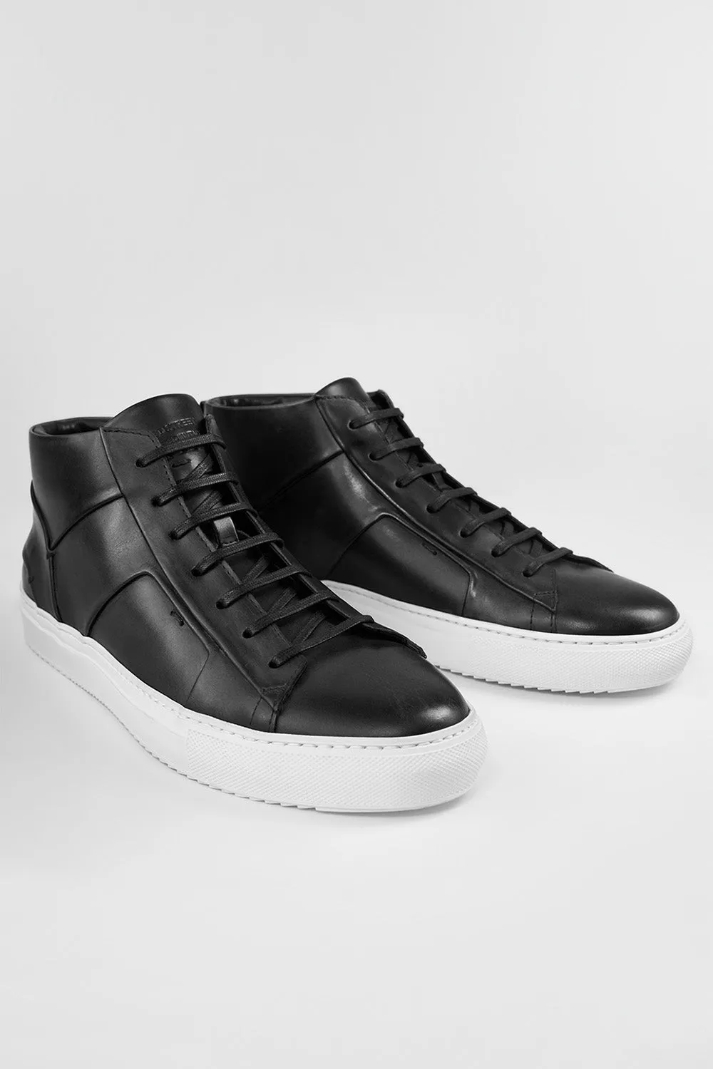SKYE tuxedo-black folded mid sneakers.